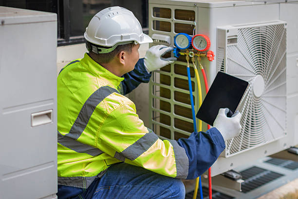 Professional Heat Pump Repair technician working in Wayne, IL